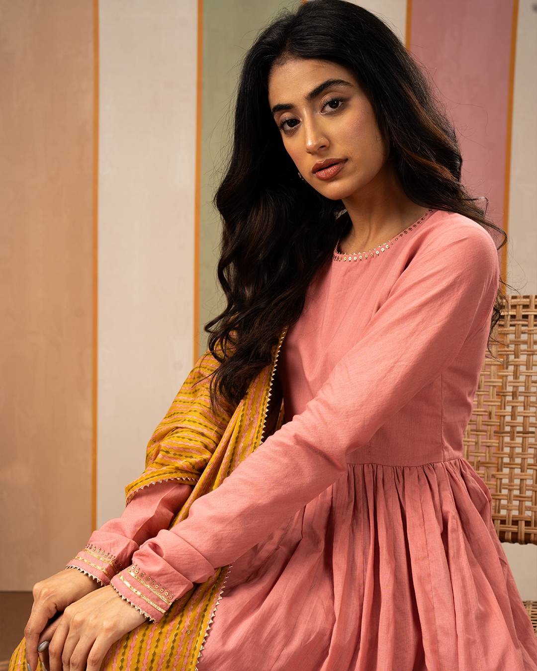 Pink Solid Cotton Flare Kurta Set with Printed Yellow Dupatta